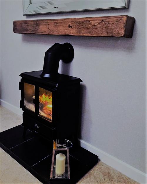 Floating oak mantel shelfÂ 