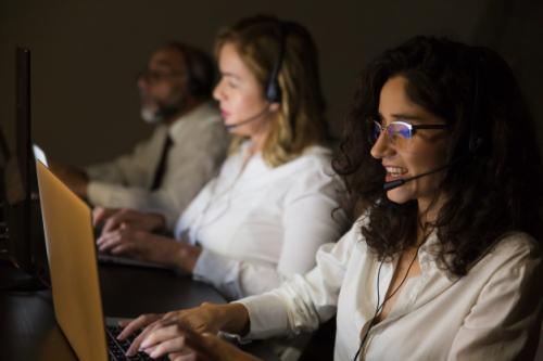 customer-service-workers-dark-office_74855-2733